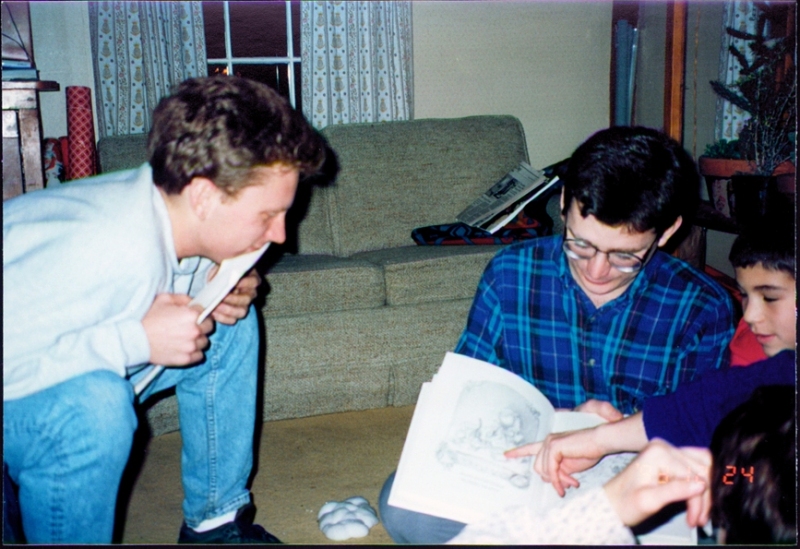 Uncles Martin & Will looking at illustrations in "Twas the Night Before Christmas"