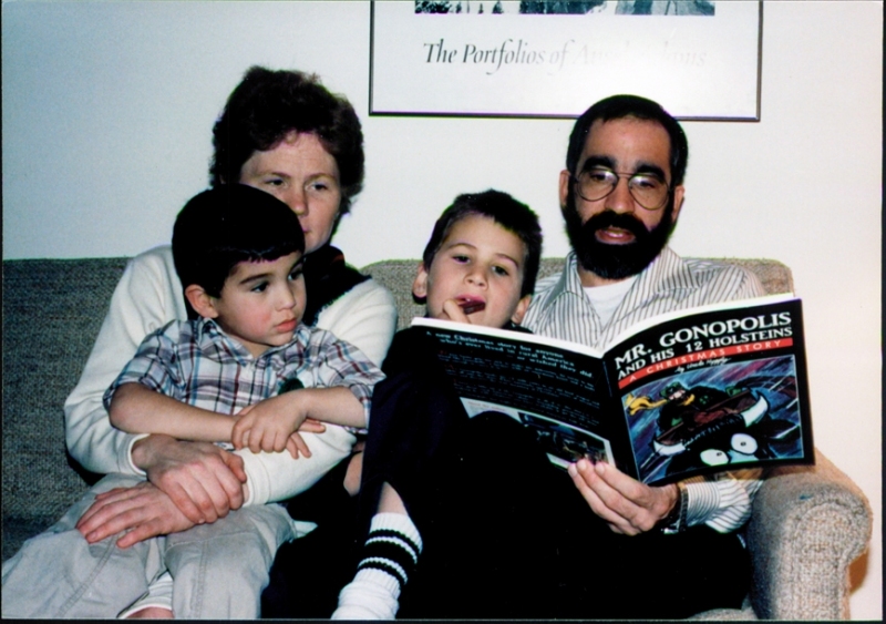 Young family reading Mr. Gonopolis