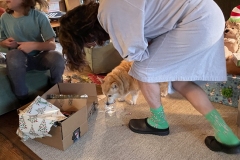 Austin watching Sally drink from a cup