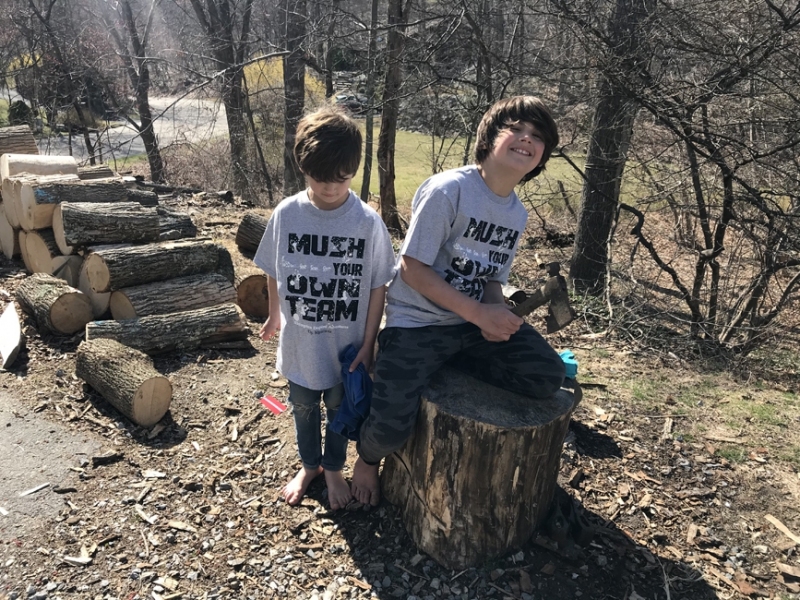 Showing off dogsledding t-shirts from GooGie