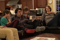 Austin reads "Mr. Gonopolis" to rapt audience, Christmas Eve