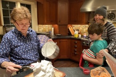 Jani preparing baked alaska while Jude and Nicole look on