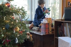 Sam examines a present