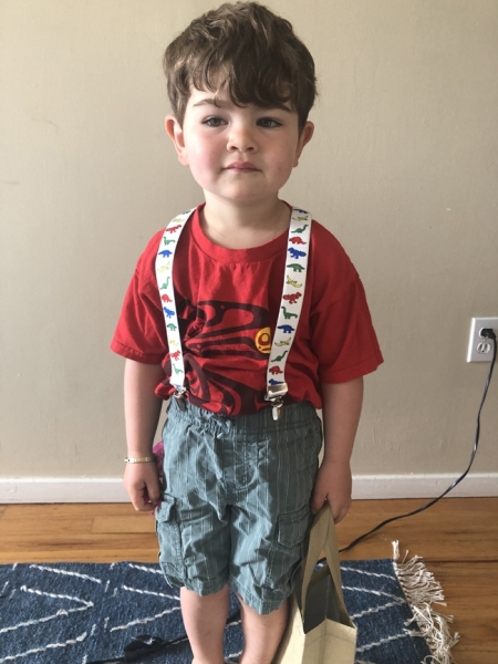 Luca displays his dino-suspenders