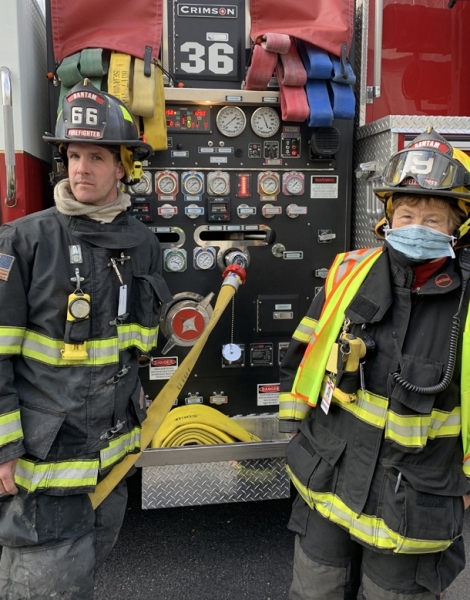 Helping to pump a firetruck, Photo by Visko Hatfield