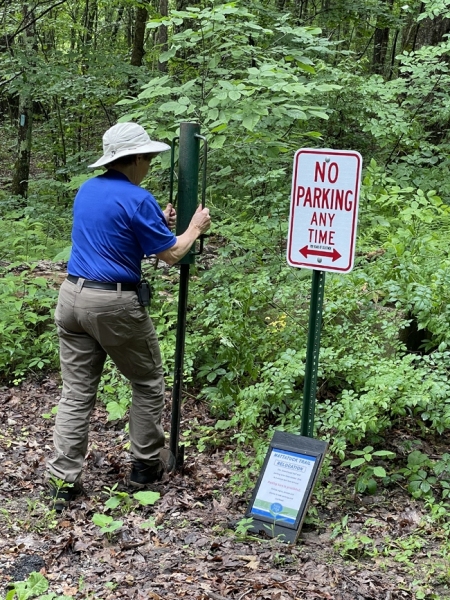 Jani setting a post for new signage