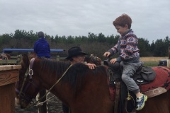 Emmett on horseback, preparing for Montana trip