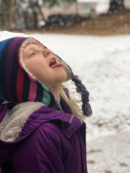 Maddie tasting snowflakes