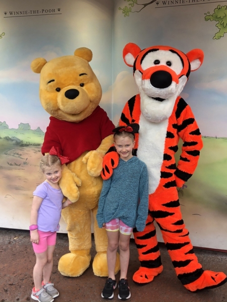 Maddie & Aurora at Disney World with Pooh and Tigger