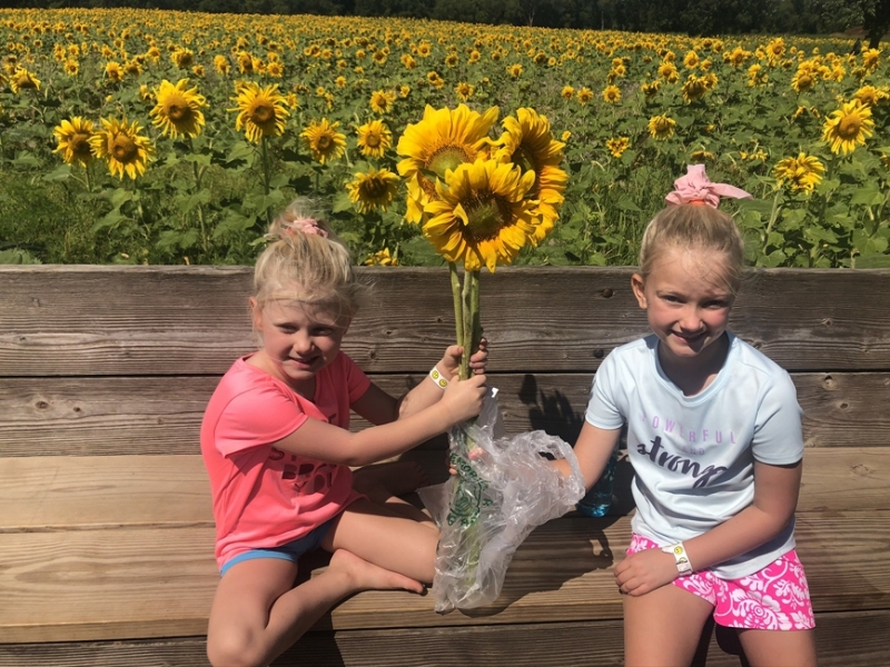 Maddie & Aurora with sunflowers
